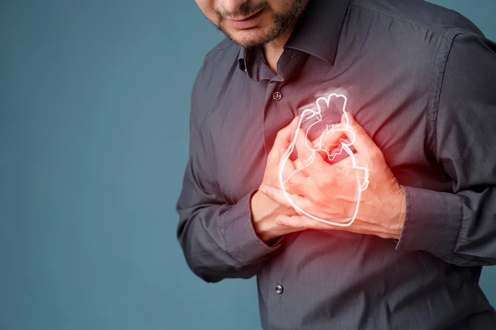 person holding the heart in his hand